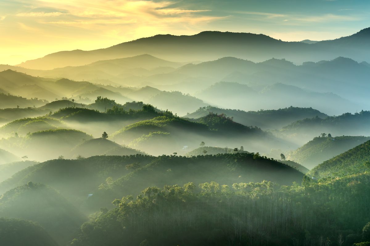 Misty mountain ridges at sunrise